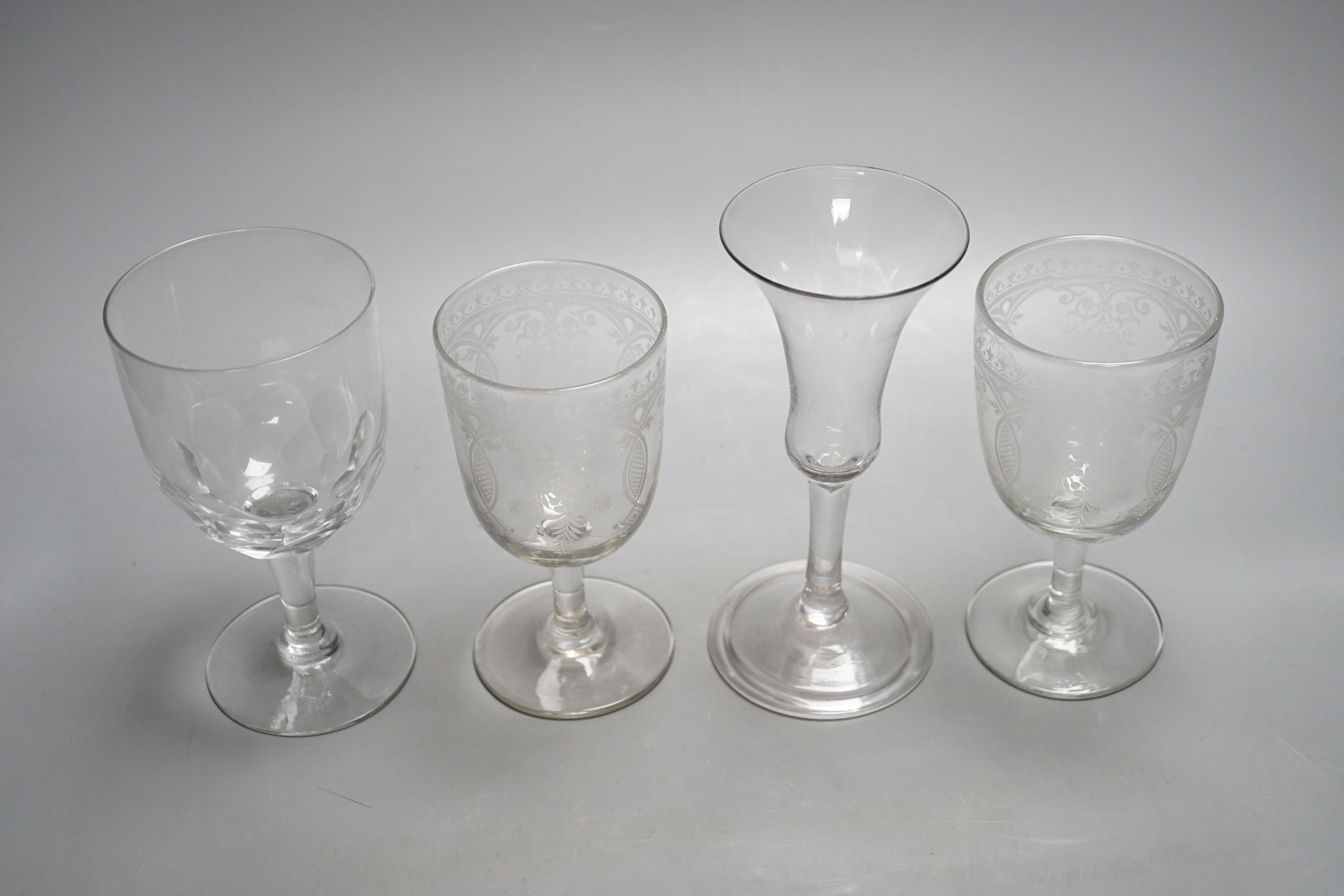 A mid 18th century trumpet bowled wine glass and three other glasses, 18cm